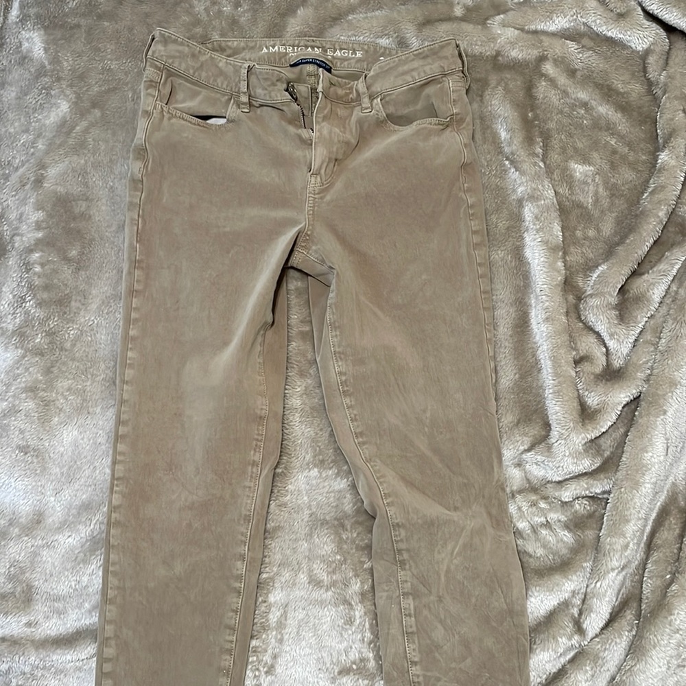 tan khaki color super super stretch times four size four American Eagle jeans